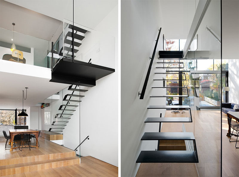 Black steel plates were welded together to create these modern floating stairs that are protected on one side by a glass window that keeps the staircase bright and visually connected to the rest of the home.