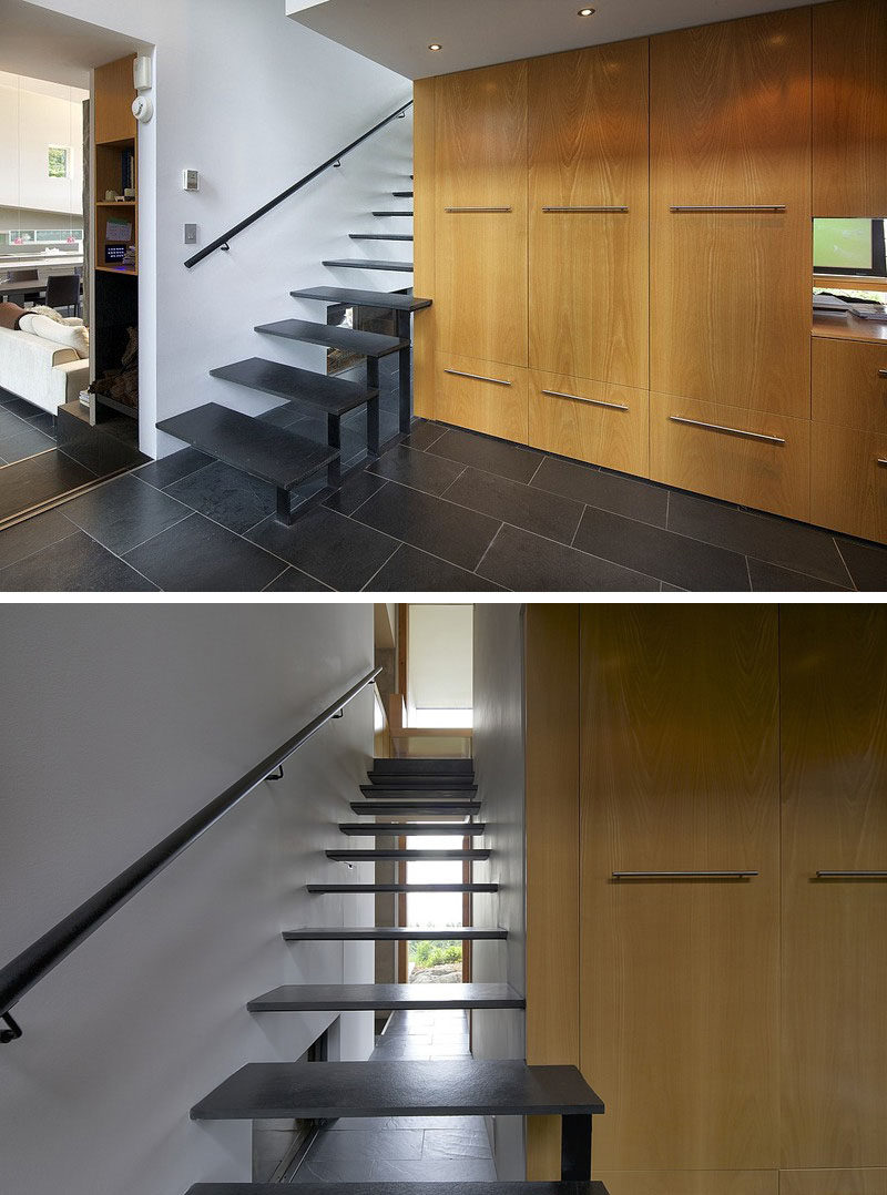 These thin black stairs let light pass through the openings and make the staircase feel bright and airy despite the black color of the steps.