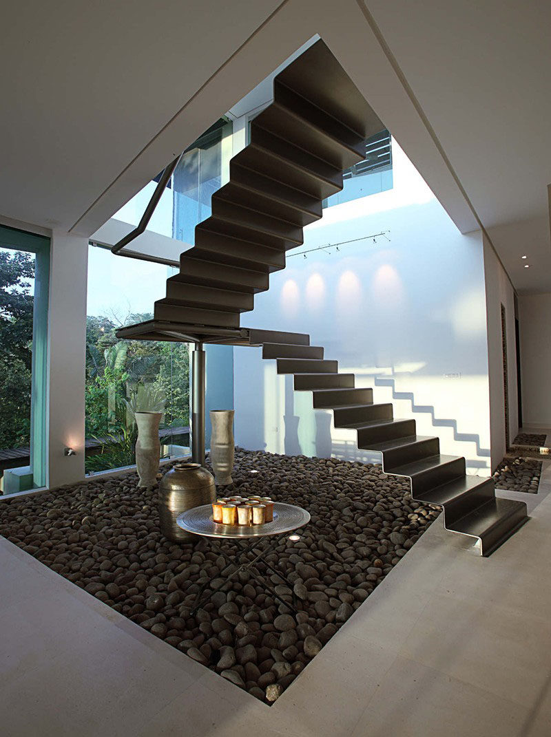 12 Black Stairs That Add A Sophisticated Touch To These Modern Homes