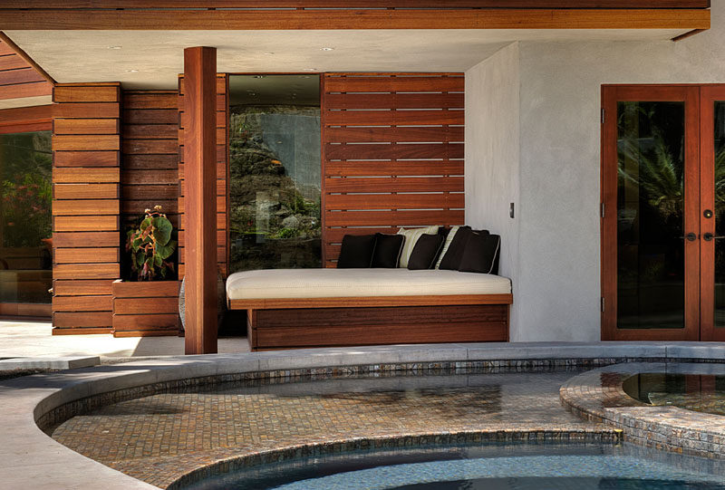 This shaded built-in daybed offers a cool escape from the sun but still keeps you connected to what's going on in the yard.