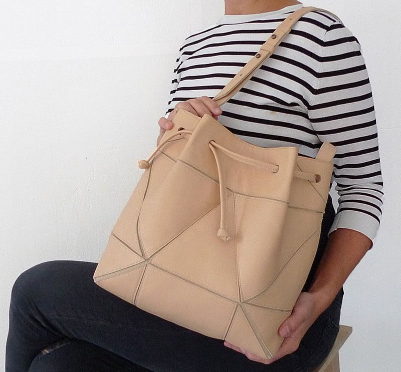 The Fold It! Bucket Bag was designed to allow you to get multiple styles out of a single bag. Able to be both a large bucket bag and a smaller cross body bag, the Fold It! Bucket bag uses geometric design to create a simple modern purse.