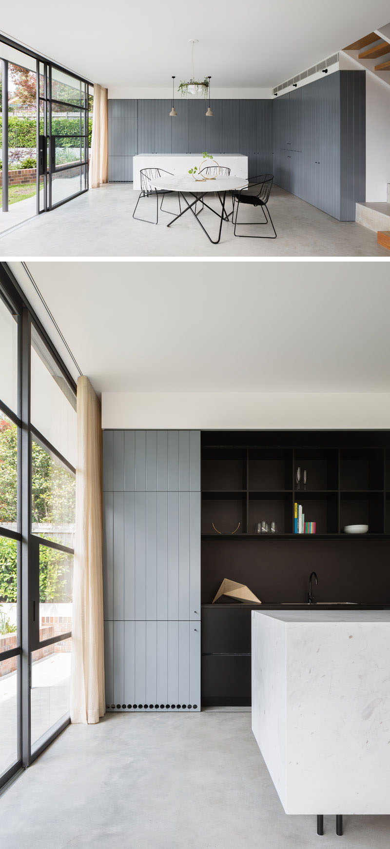 In this modern kitchen, grey cabinets that match the ones in the living space provide lots of storage and conceal the black work space behind sliding doors. The white marble island creates extra room for prepping meals and the simple modern table is just the right size for the small family.