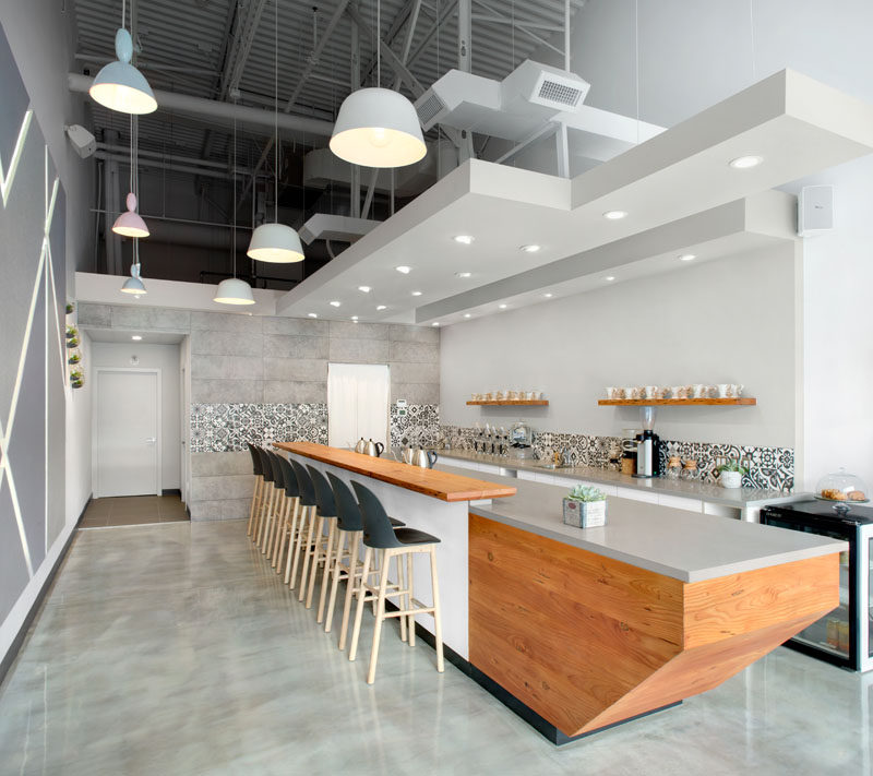 This Modern Coffee Shop Has A Palette Of Grey, White, And Wood