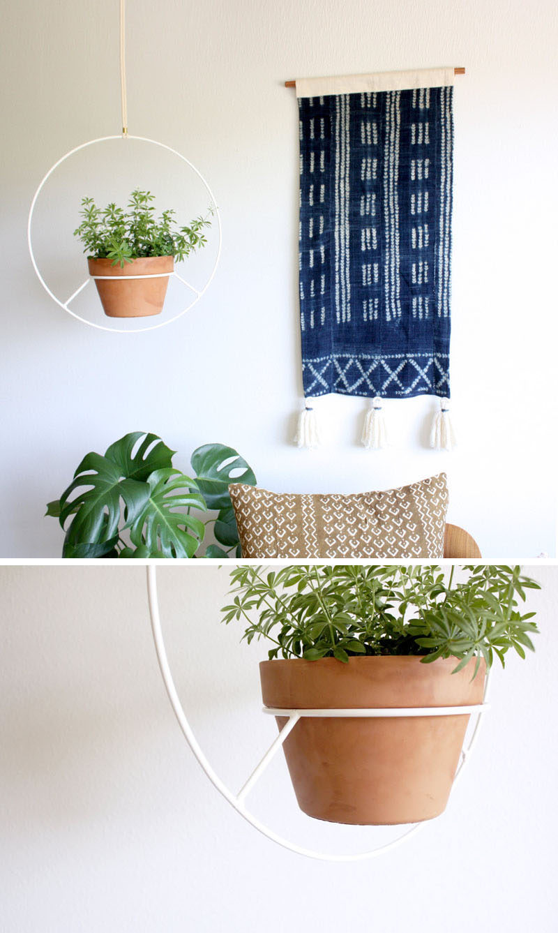 Inspired by vintage hanging plant holders, Angie Johnson has created this modern white hanging planter.