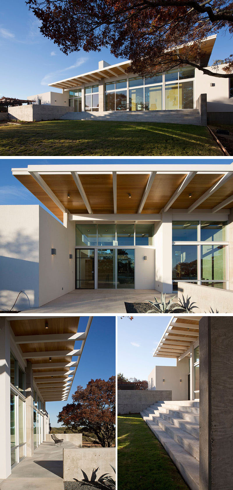 At the front of this modern house, the large overhang of the roof provides protection from the elements while also allowing plenty of natural light to pass through the massive windows along the entire front of the home. A sunny concrete patio and concrete steps allow people to make the most of a sunny day outside.