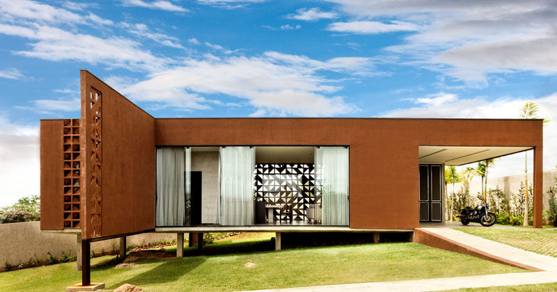 1:1 arquitetura:design have designed Casa Clara, a small house in Brazil for a couple and their child, that has a steel frame and a decorative block pattern.