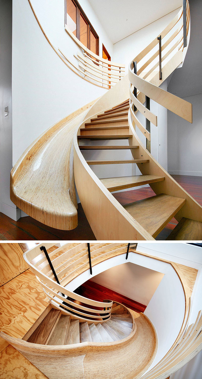 This curved wood staircase has a slide built-in right next to it to give you the option of taking the stairs or the slide when you descend to the main floor.