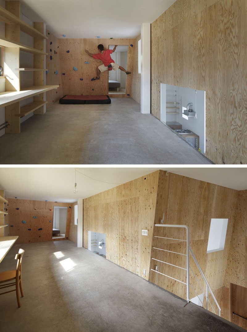 The rock climbing wall in this modern house has been placed on a slight angle to make the climb more challenging and wraps around the wall to give you more of a workout. #RockClimbingWall #InteriorRockClimbingWalls #InteriorDesign