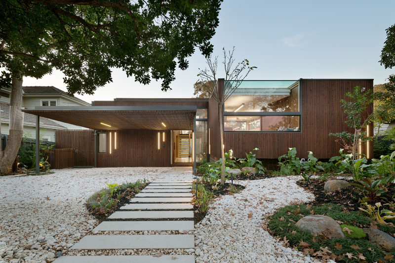 Designed to appreciate and take advantage of the beautiful Australian landscape, this home in Melbourne created by Zen Architects, features large windows, natural wood elements, and homey touches.