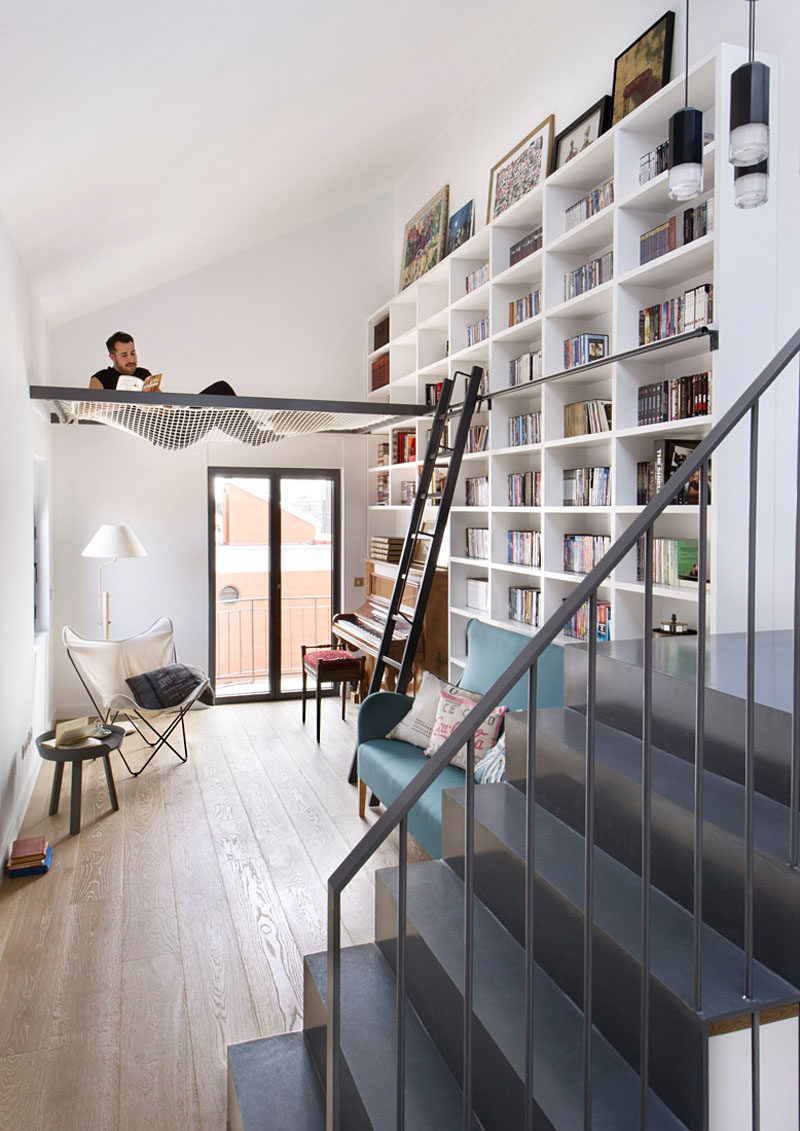 A suspended net in this living room creates a lofted space that's idea for reading and lounging in style.