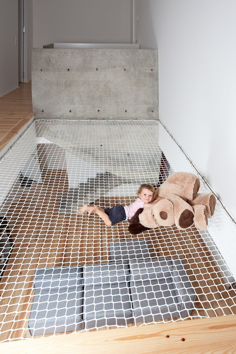 The large net above the living room in this home makes for a fun play area for the kids and a relaxing spot to lounge.