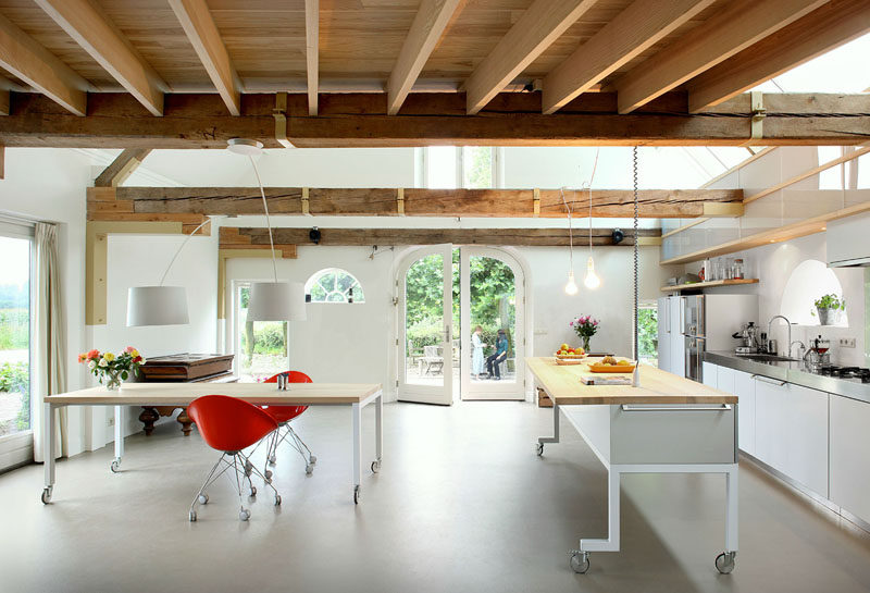 Both the modern kitchen island and the dining table can be moved in this modern interior as they both have wheels on the bottoms of them, making it easy to clear the floor and configure the layout exactly how it needs to be.