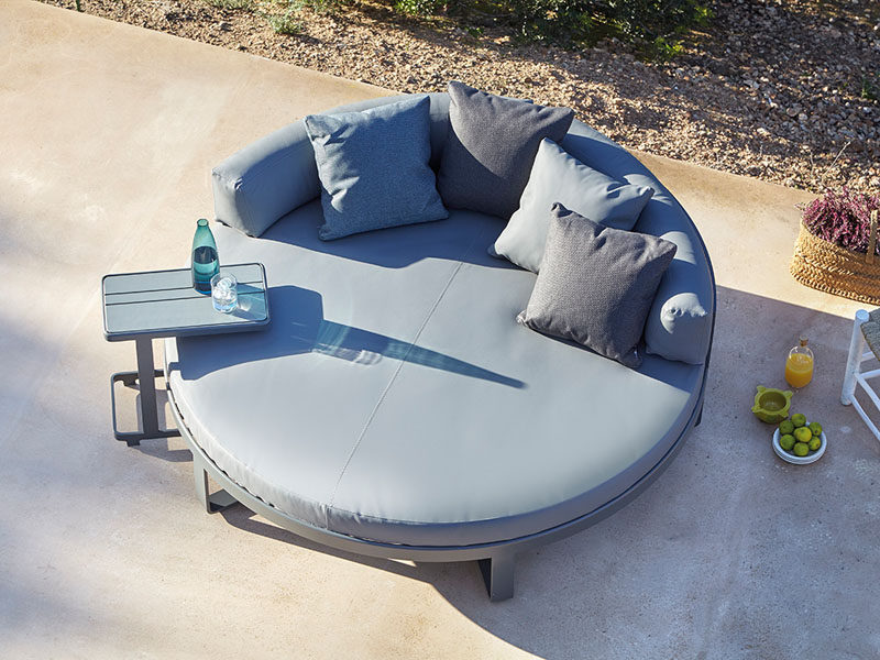 A circular outdoor bed with lots of support is great for casual lounging as well as late afternoon snoozing.