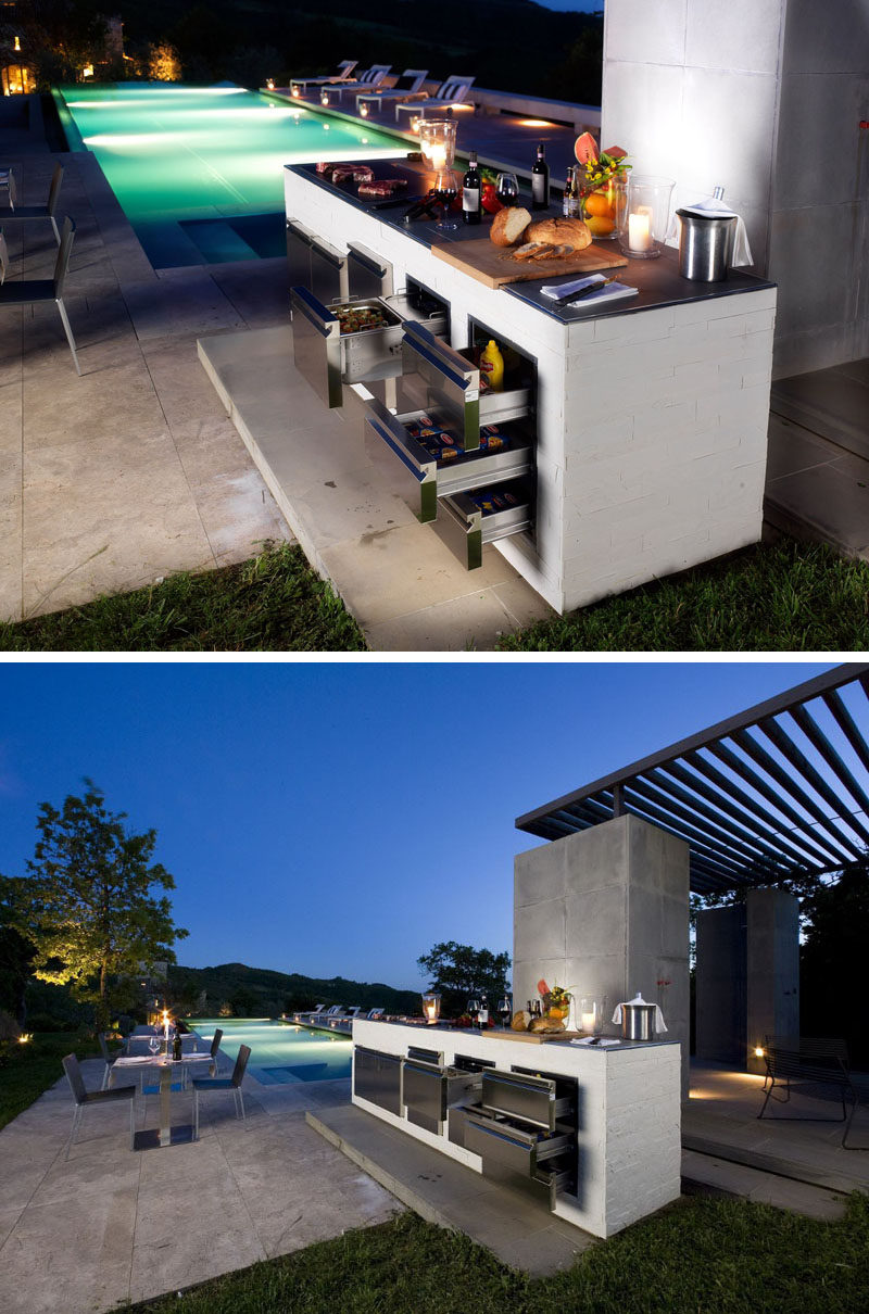 This modern outdoor kitchen and grill has built-in refrigerated drawers so that the food that needs to be kept cool right up until it hits the grill is fresh, even if you have to cook it later.