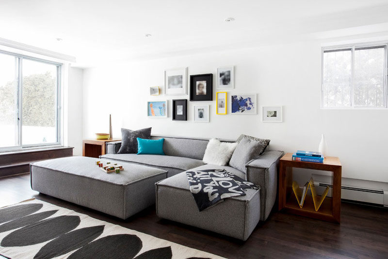 The combination of black, colored, and white frames give this gallery wall a fun, playful look that reflects the life of the family living in the home.