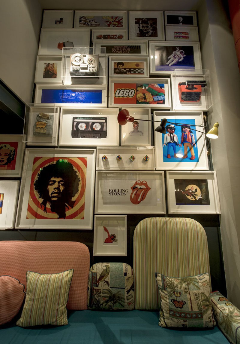 The gallery wall in this cafe combines prints with objects framed in glass boxes to add more dimension to the wall, and allow for more than just art to be included.