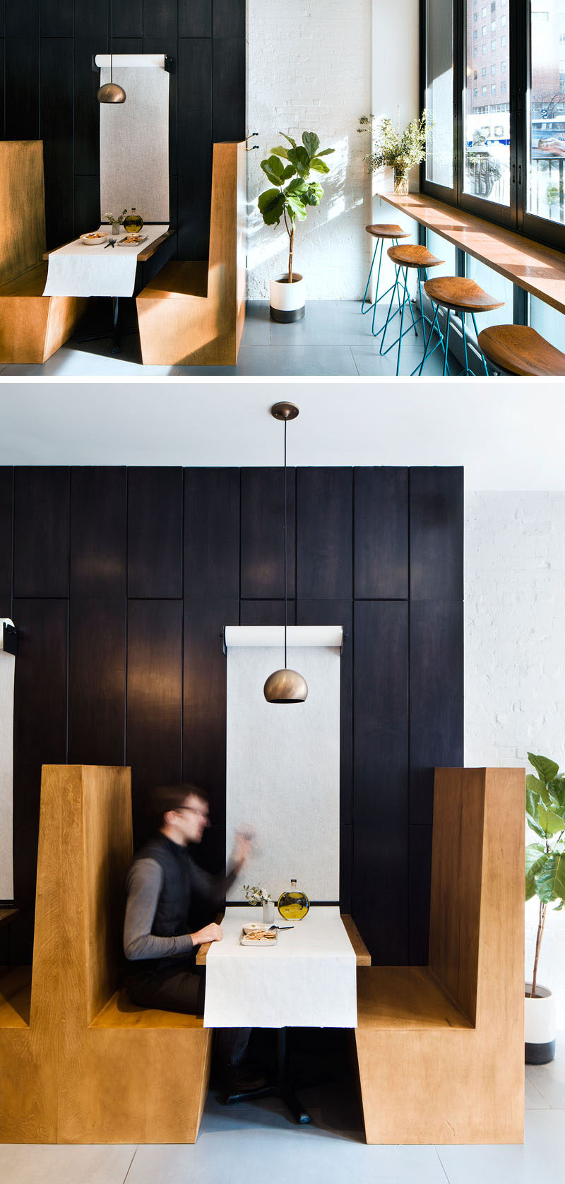 In this small modern restaurant, rolls of paper attached to the wall above each of the booth tables provide the tablecloth and make it easy to clean the table between customers. The large rolls of white paper also contribute to the casual feel in the restaurant and contrast the black paneling along the wall.