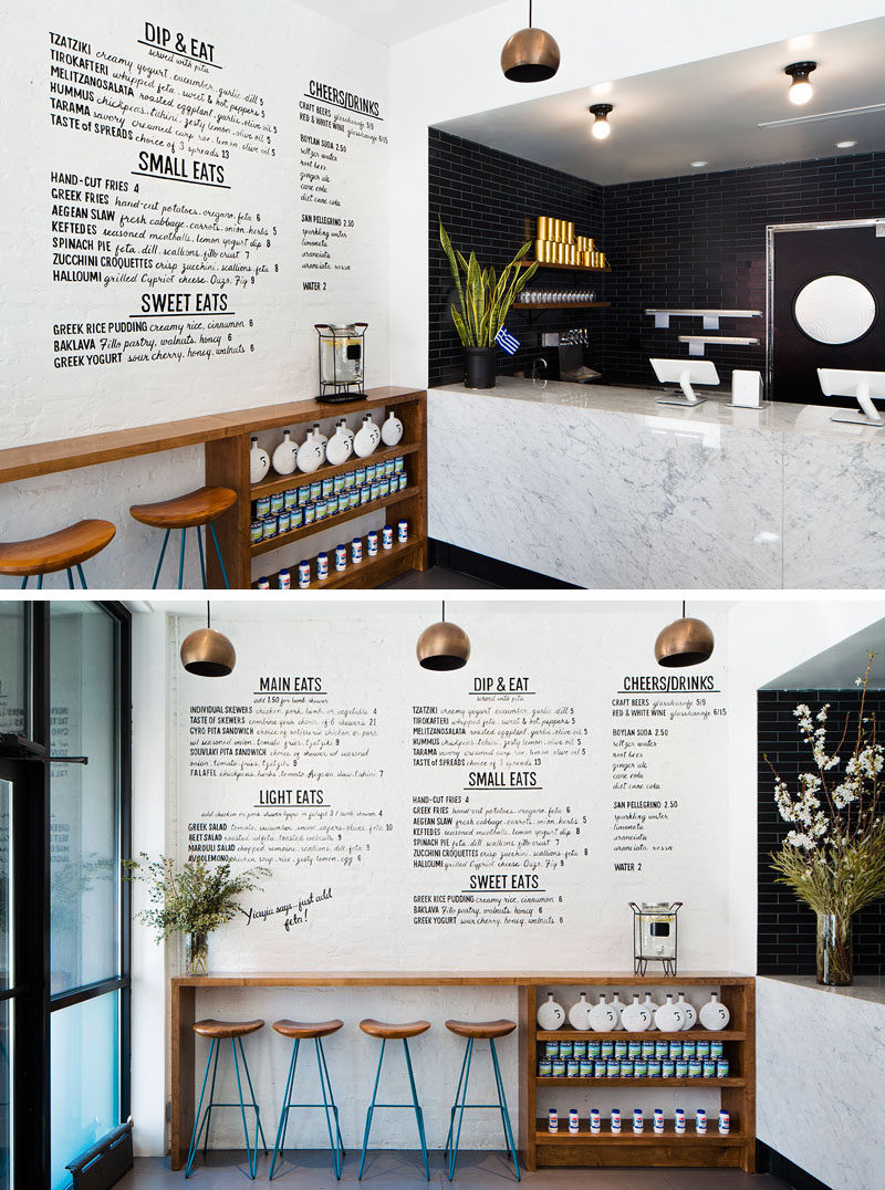 In this small modern restaurant, black subway tiles and a large marble counter create a sophisticated look, while the handwritten menu on the white wall and the natural look of the stools and counter gives the space a casual vibe.