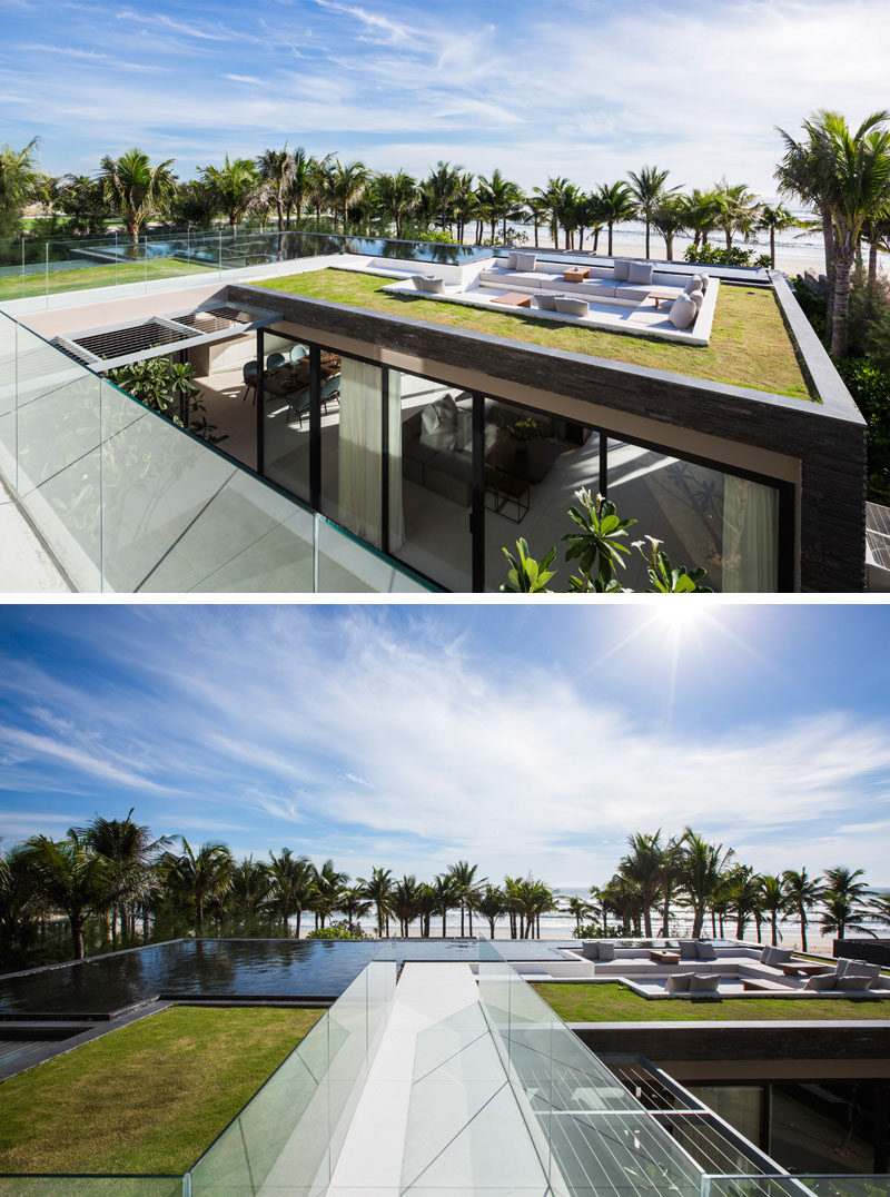 The sunken lounge space on the roof of this beachside villa has built-in couches that warp around the sides, and a water feature and green roof surround the area.