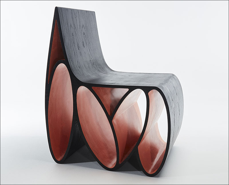 Jason Mizrahi has designed the Loop Chair, a sculptural wood chair made from ash with a lacquered ebony finished veneer.