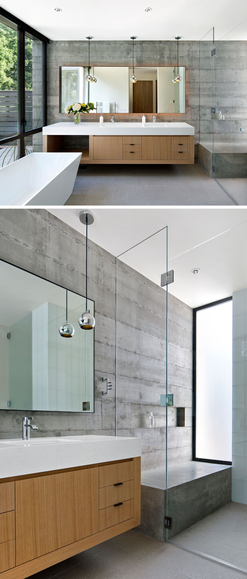 In this modern bathroom, the concrete walls and details, like the white standalone tub, floating double vanity with ample storage, and large backlit mirror, give the bathroom a contemporary feel while at the same time give it a warm and inviting look. In the shower, there's a large concrete bench to match the concrete walls, and a glass shower screen keeps the vanity dry.