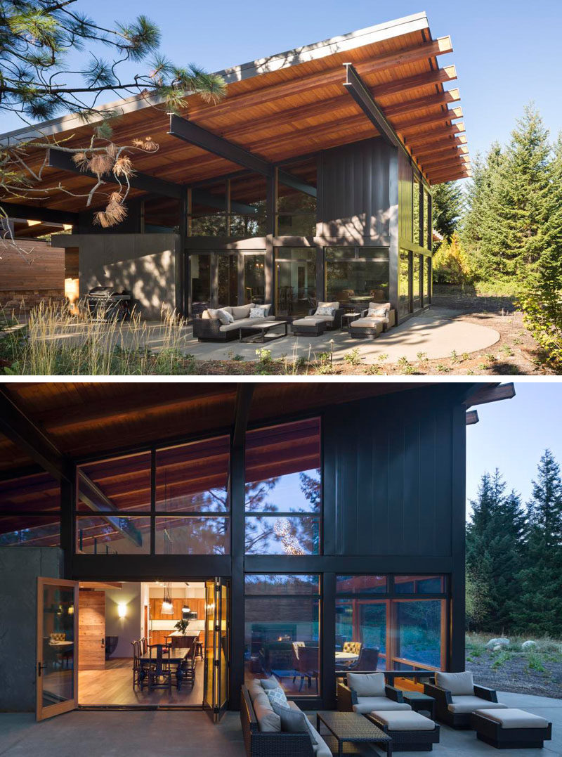 This modern cabin has a sloped roof that provides some shelter from the elements and makes it easier to enjoy the outdoor seating area regardless of what the weather is doing. And if it suddenly takes a turn for the worse, the doors leading back inside are right beside the seating area.