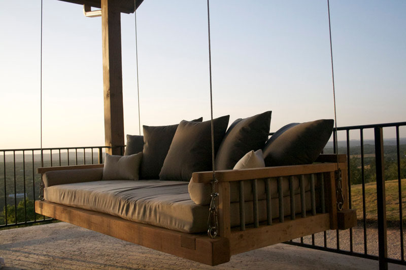 Hang up this wood outdoor swing bed and curl up with a book or a blanket for a cozy, relaxing retreat.