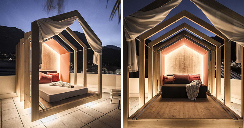 This modern outdoor rooftop bedroom with hidden lighting, has an extendable wood cabana that can be as open or closed as you want, allowing you to sleep under the stars.