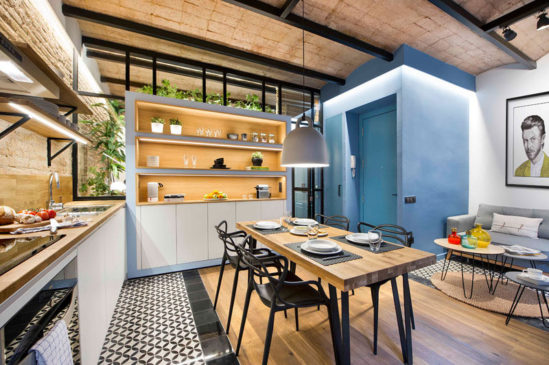 When redesigning this small 430 square foot (40m2) Barcelona apartment, Egue y Seta wanted to create a modern, connected space that retained some of the rustic charm of the building like the brick work, and included privacy options when desired. 