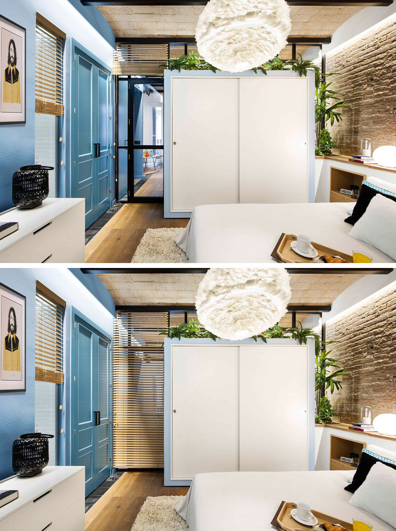 In this small modern bedroom, a closet was created by extending the storage unit in the dining area into the bedroom, adding closet storage solutions inside, and covering it with white sliding doors. This unique unit creates continuity in the apartment and adds extra functionality to a single piece of furniture.