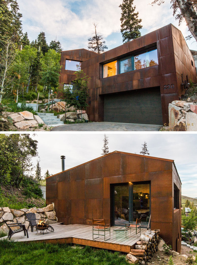 Up in the trees, this home covered in weathering steel has a modern, rustic look to it that contrasts the natural landscape around it.