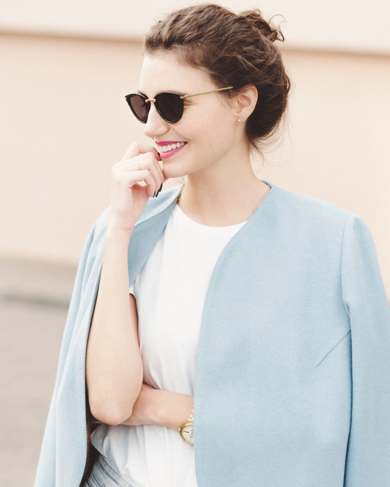 This light pastel blue minimalist womens spring coat, made from wool and a viscose lining, adds a soft touch of color to any outfit and keeps you warm on cooler days.