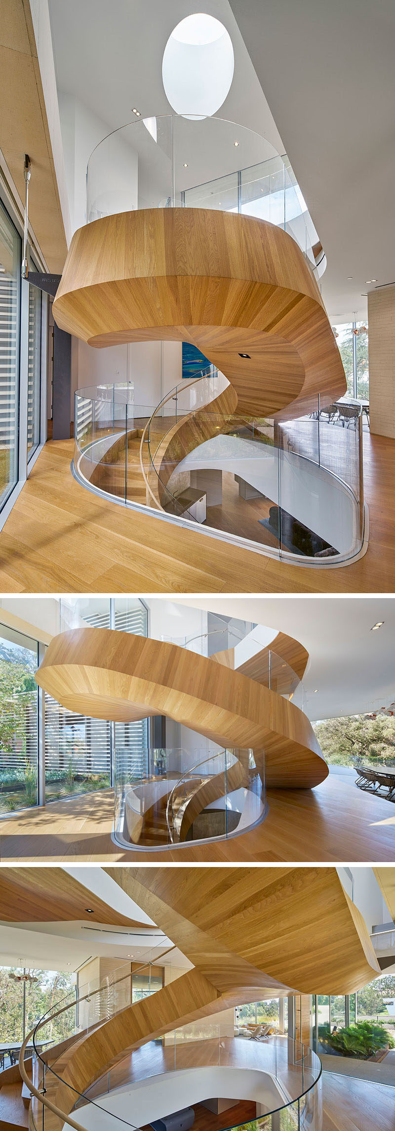 This large wood and spiral staircase not only connects various levels of the home but also divides the space and acts as a sculptural installation. #SpiralStairs #SpiralStaircase #ModernSpiralStairs #WoodSpiralStairs