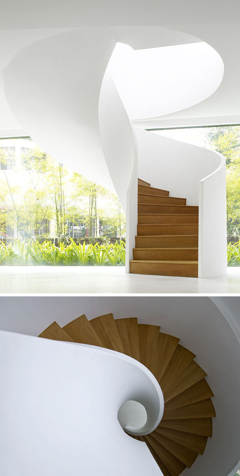 The smooth appearance of this modern white and wood spiral staircase makes it look like it could have simply twisted down from the ceiling. #SpiralStairs #SpiralStaircase #ModernSpiralStairs