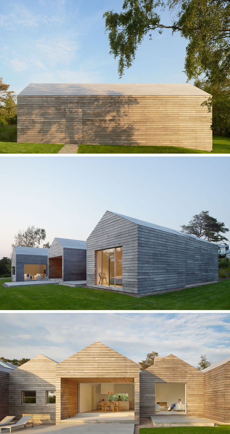 The design of this modern Swedish house, with its peaked roofs and horizontal wood plank siding, was inspired by the wood barns found in the surrounding area.