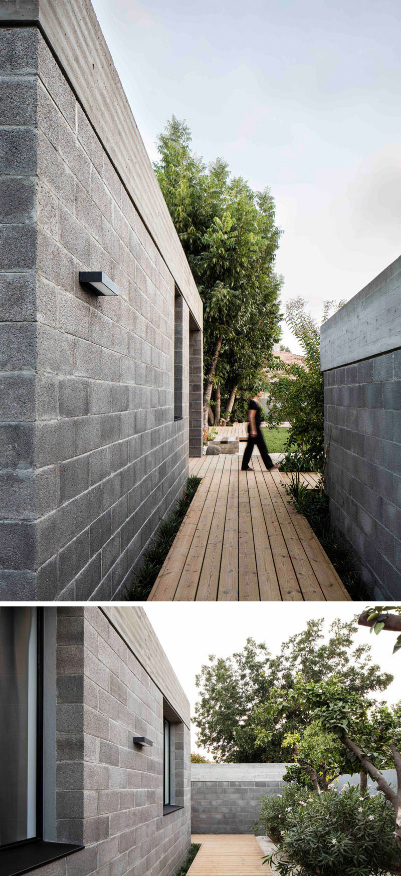 This modern house used raw concrete blocks and a concrete roof in its construction. Wood paths lead you around the house.
