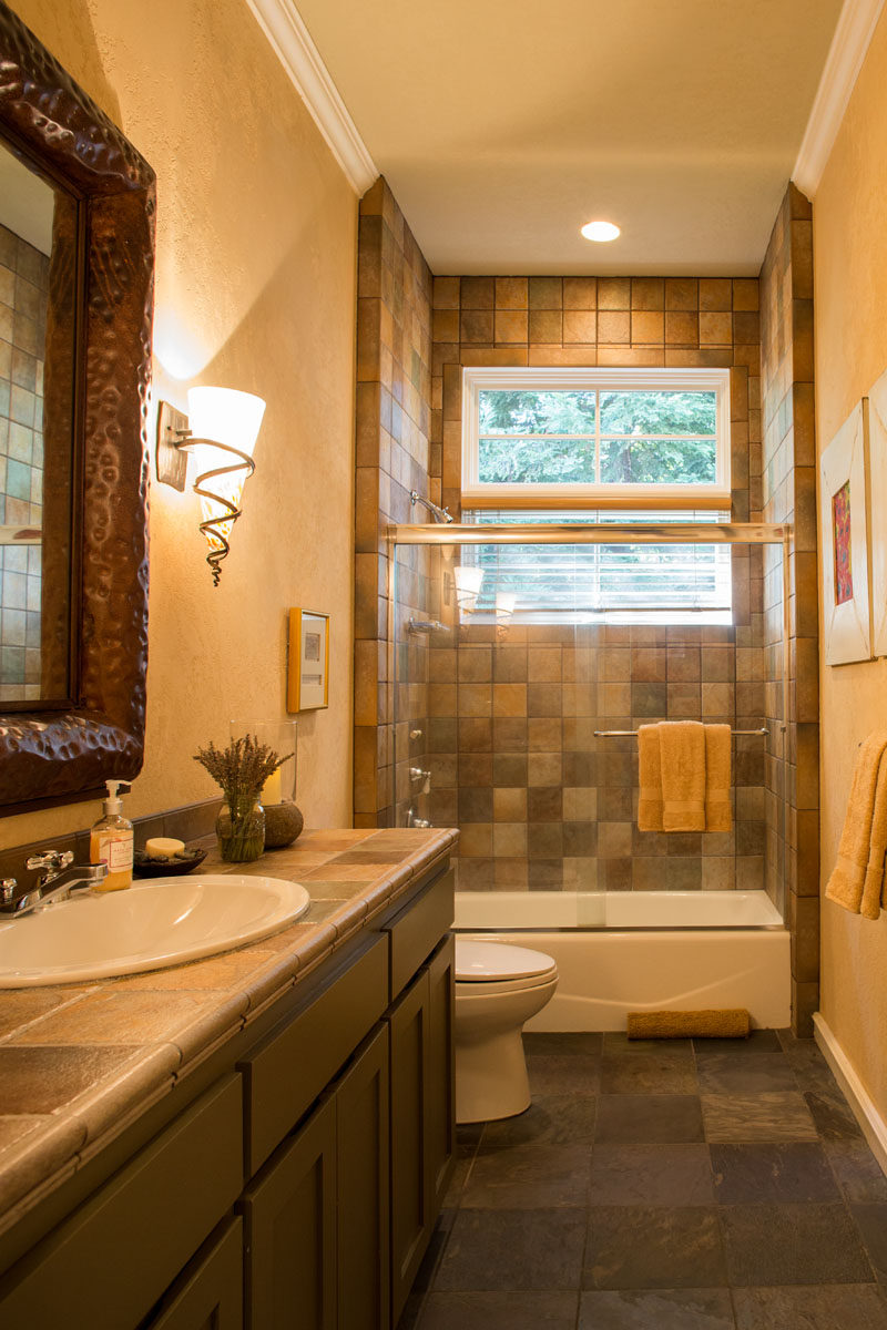 A dated and dark farmhouse was turned it into a bright and airy modern house. This is the before photos of the bathroom