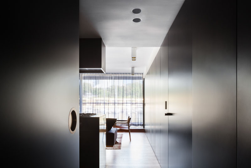 Architect Prineas have designed the interior for this sophisticated modern apartment in Sydney, Australia, that features plenty of black and gold accents.