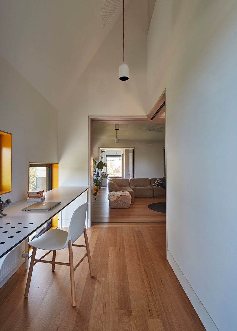 This small hallway can be closed off from the living room, and has a small home office area.