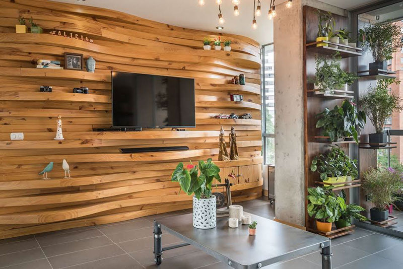 Image showcasing A Wavy Wood Accent Wall Creates Multiple Shelves In This Apartment