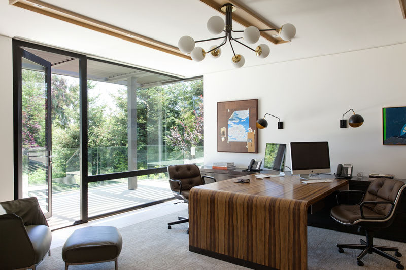 The modern house also has a home office large enough for two people to work together, and when it's time for a break, there's access to a balcony.