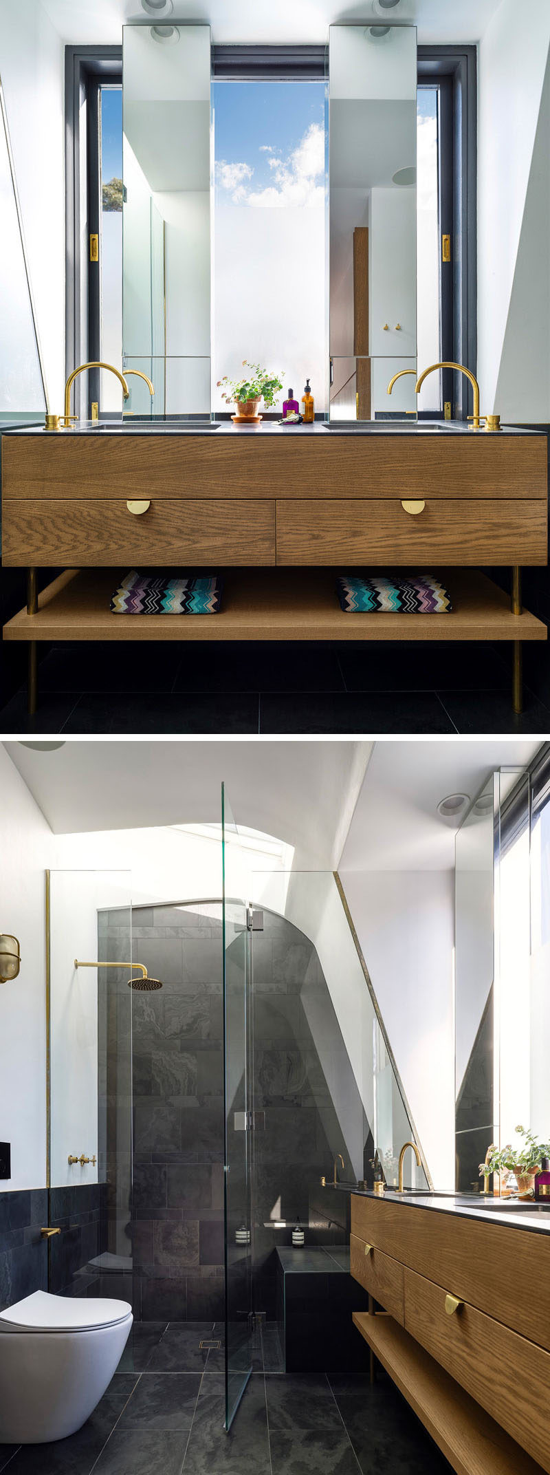 In this master ensuite bathroom, tall vertical mirrors let in the light from the window, while in the grey tiled shower, a skylight lets you stare at the sky as you shower.