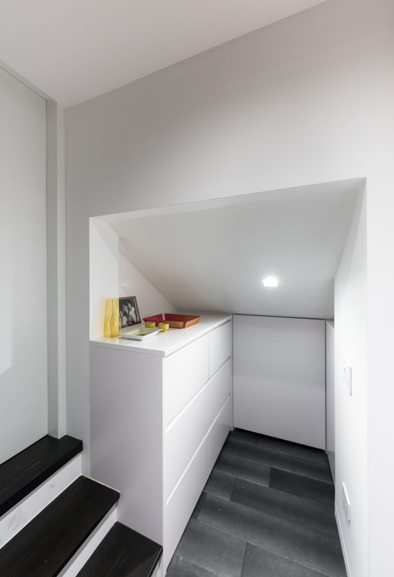 This micro apartment has a small entry space that houses a cabinet with storage, a must have item when designing such a small space.