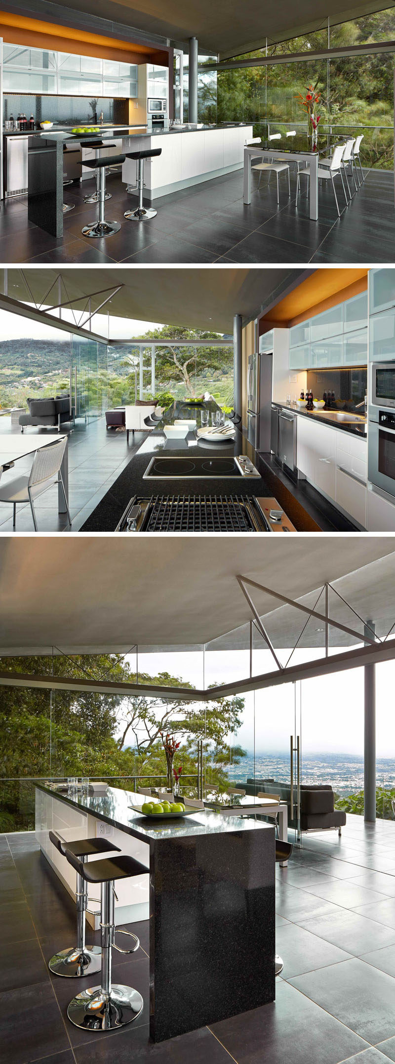 This modern kitchen has a large island with a dark countertop and additional room for counter stools. On three sides of the room are floor-to-ceiling windows, allowing guests to immerse themselves within the scenery.
