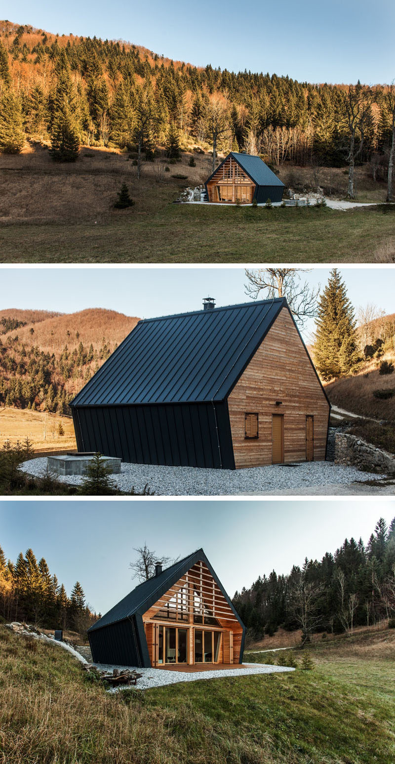 studio PIKAPLUS have designed this small two bedroom house surrounded by woods in Slovenia, that has an exterior of black metal siding and a softer light wood interior.