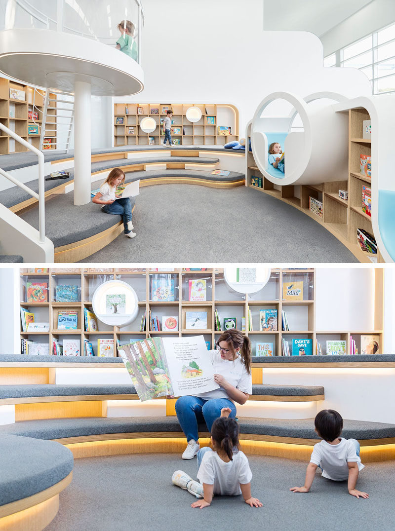 This quiet room at a children's play center has a with a library of books, where the children can sit and read by themselves, or with an adult. Tiered seating and various reading nooks create unique spaces for reading and storytelling.