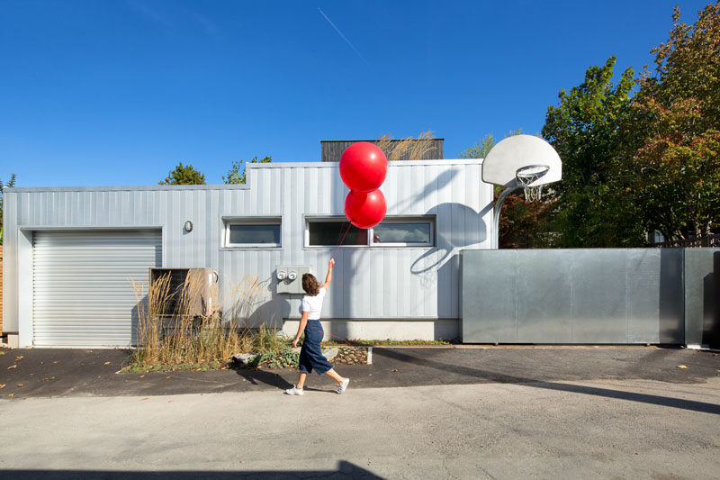 This modern garage has a small laneway house beside it.