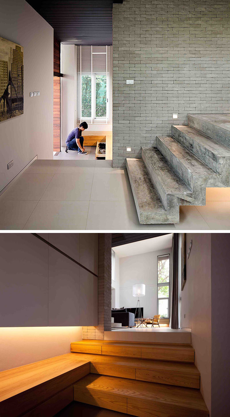 The foyer in this modern house has built-in storage drawers for hiding shoes.