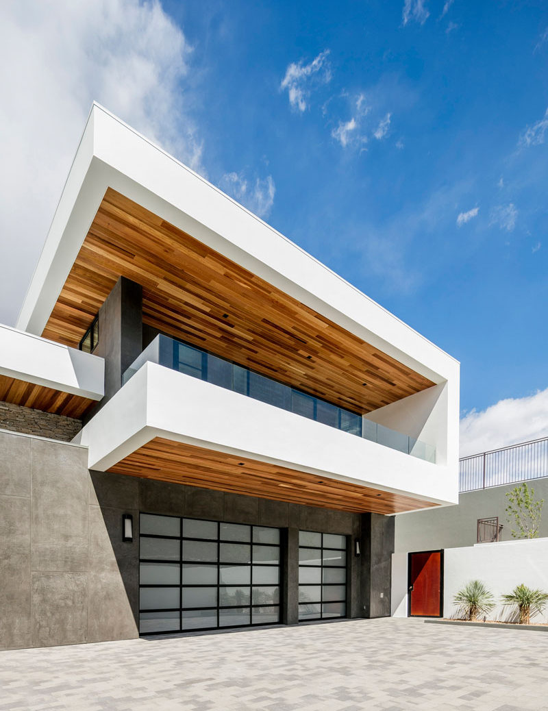 This modern house, which is located on a unique triangular lot, is totally private from the street, and has wood elements throughout.