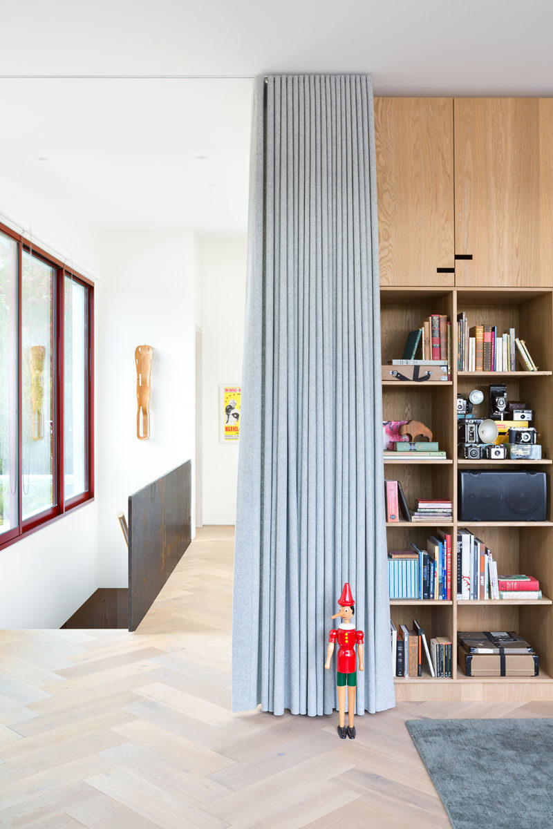 In this modern house, the light wood floor has been arranged in a herringbone pattern.